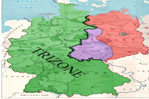 Ein Plakat, das eine Deutschlandkarte mit den Trizonen-Provinzen in verschiedenen Farben hervorhebt, begleitet von erklärendem Text.