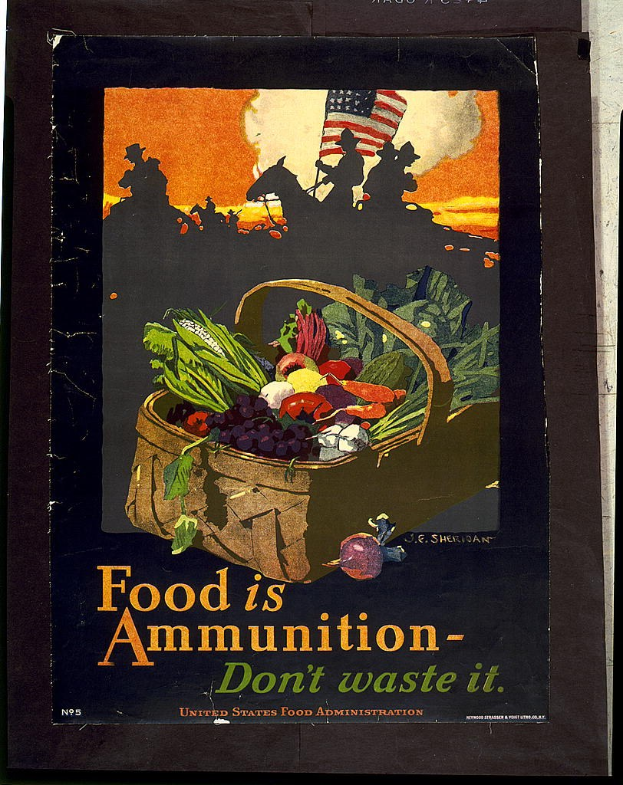 Plakat an einer Wand mit einem Korb voller Karotten, Kartoffeln, Zwiebeln und Paprika mit dem Text "Food is Ammunition - Don't Waste It."