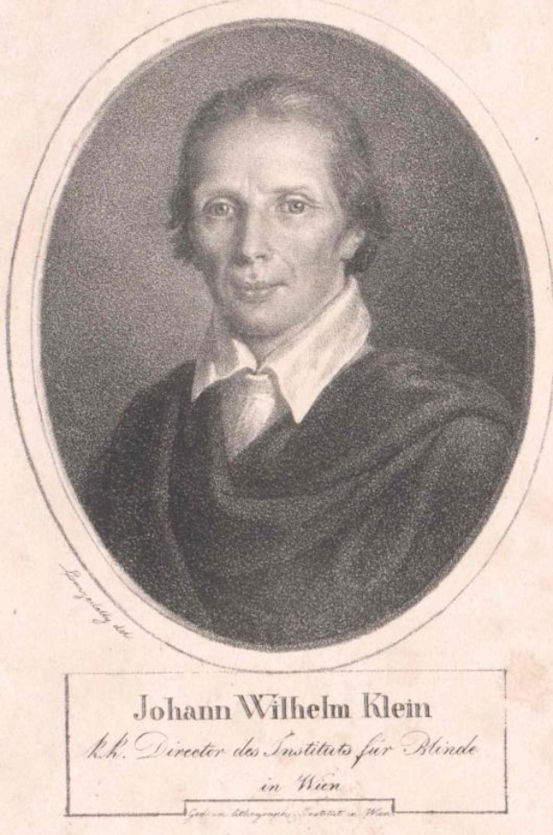 Schwarzes und weißes Porträt von Johann Wilhelm Klein, Direktor des Instituts für Blinde in Wien, der einen weißen Hemd und einen ernsten Gesichtsausdruck trägt, mit deutschem Text unten.